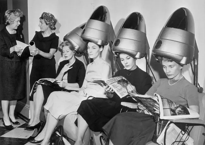 : Women Sitting Under Hair Dryers in Television Show : Women Sitting Under Hair Dryers in Television Show