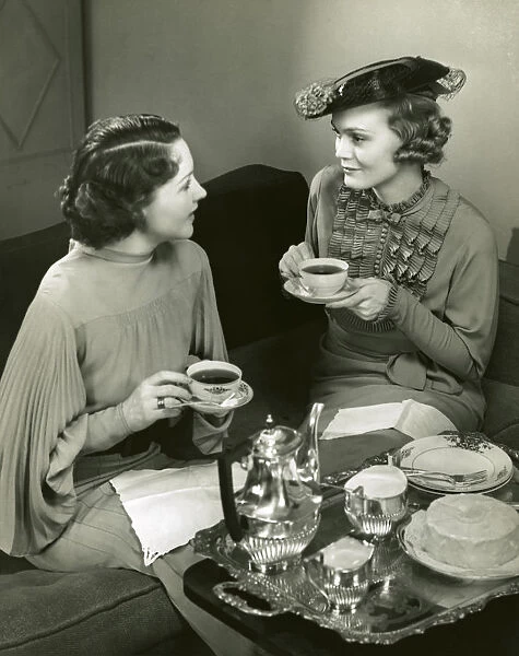Two women socializing and drinking tea