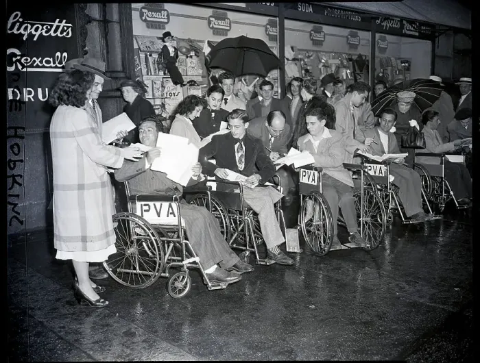 Framed Print : Women Taking Signatures From Wheelchair Framed Print : Women Taking Signatures From Wheelchair