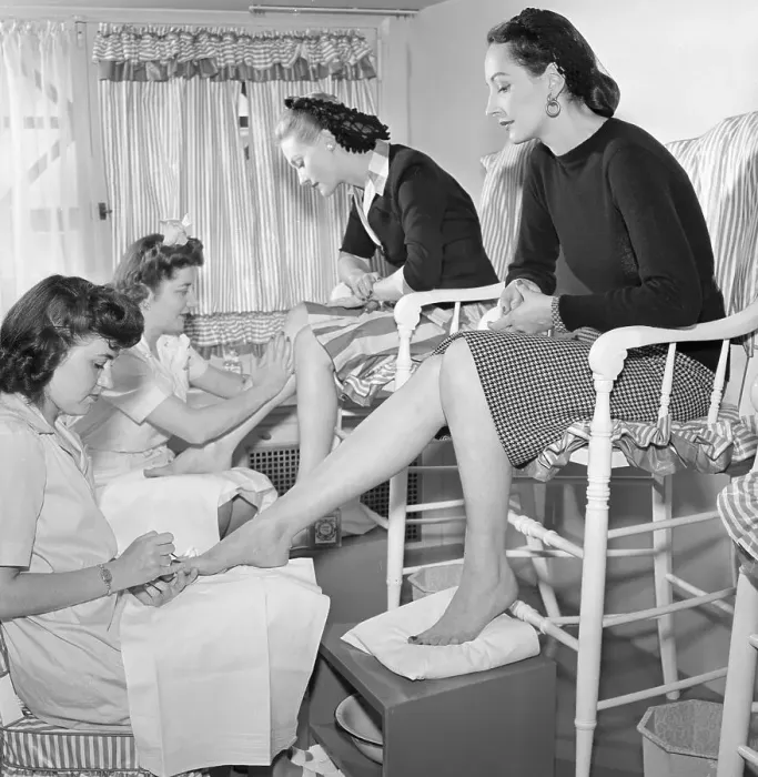 Framed Print : Women Being Treated at Leg Bar Framed Print : Women Being Treated at Leg Bar