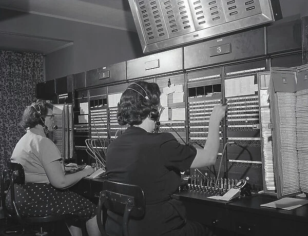 Two women wearing headsets, working on telephone switchboard. (Photo by H. Armstrong Roberts / Retrofile / Getty Images)