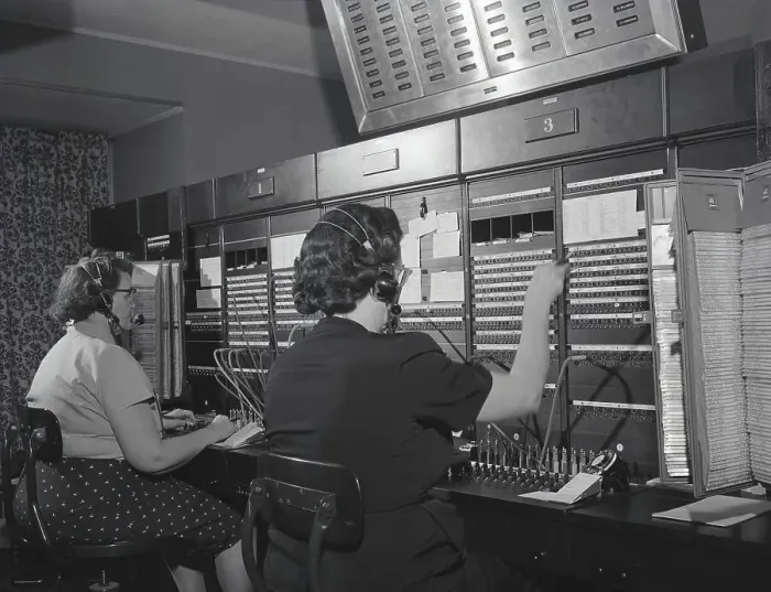 Framed Print : Two women wearing headsets, working on telephone switchboard. (Photo by H. Armstrong Roberts / Retrofile / Getty Images)