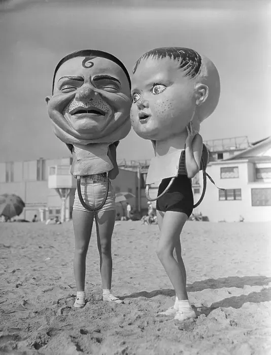 Framed Print : Women Wearing Large Papier Mache Heads Framed Print : Women Wearing Large Papier Mache Heads