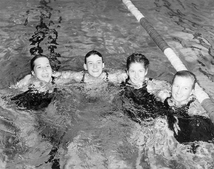 Framed Print : Women's Swimming Relay Team in Pool Framed Print : Women's Swimming Relay Team in Pool