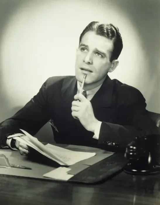 Framed Print : Wondering businessman at desk, (B&W), portrait Framed Print : Wondering businessman at desk, (B&W), portrait