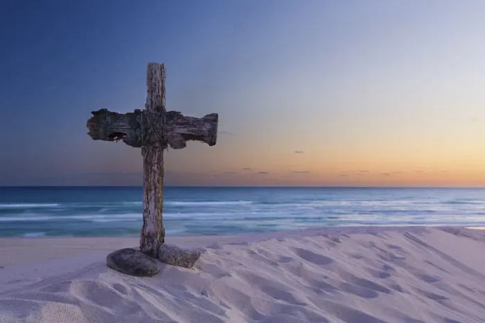 Framed Print : Wooden cross on a beach at sunset - De Mond, South Africa
