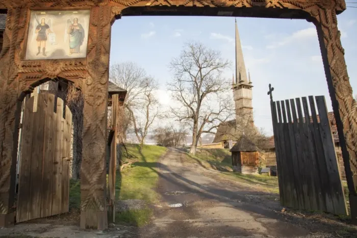Framed Print : Wooden gate and orthodox church of Surdesti