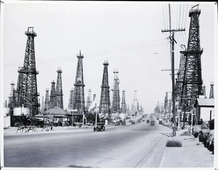 Framed Print : Wooden Oil Derricks Surrounding Road Framed Print : Wooden Oil Derricks Surrounding Road