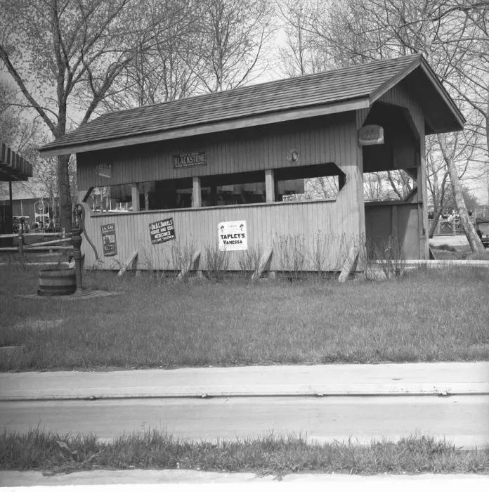 Framed Print : Wooden shed by road, (B&W) Framed Print : Wooden shed by road, (B&W)