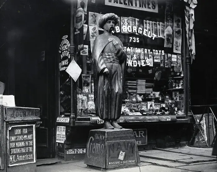 Framed Print : Wooden Statue In Front Of Shop Window