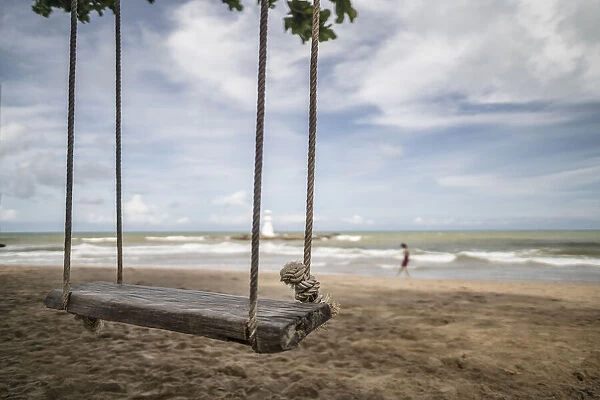 Woodern swing on the beach