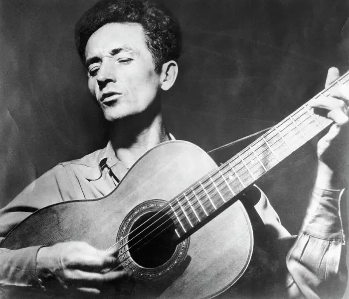 Framed Print : Woody Guthrie Playing the Guitar Framed Print : Woody Guthrie Playing the Guitar