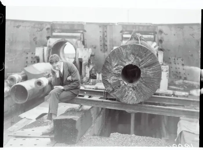 Framed Print : Worker Examining a Gun at Heligoland Island Framed Print : Worker Examining a Gun at Heligoland Island