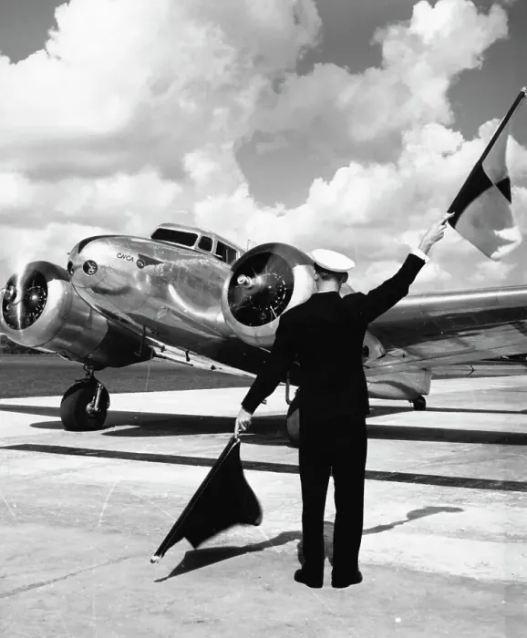 Framed Print : Worker Flagging in Airplane Framed Print : Worker Flagging in Airplane