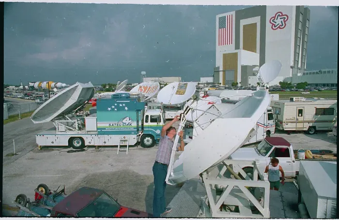 Framed Print : Worker Installing Satellite Dish Framed Print : Worker Installing Satellite Dish