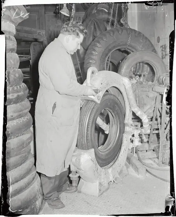 Framed Print : Worker Making a Tire Framed Print : Worker Making a Tire