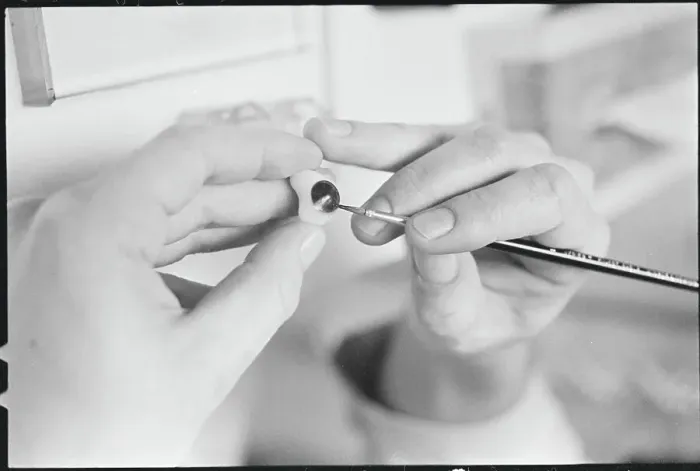 Framed Print : Worker Painting Artificial Eye Framed Print : Worker Painting Artificial Eye