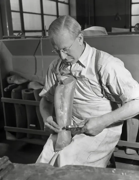 Framed Print : Worker Preparing Artificial Limb Framed Print : Worker Preparing Artificial Limb