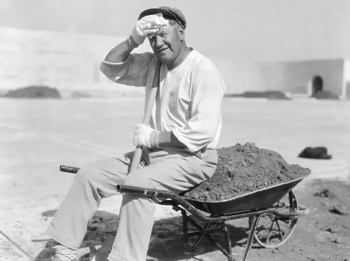 Framed Print : Worker Sitting on Wheelbarrow Framed Print : Worker Sitting on Wheelbarrow