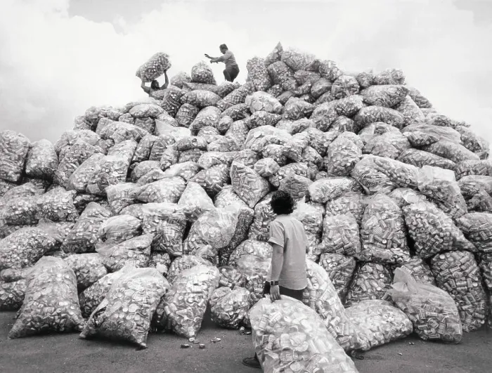 Framed Print : Workers Atop Mound of Aluminum Cans Framed Print : Workers Atop Mound of Aluminum Cans