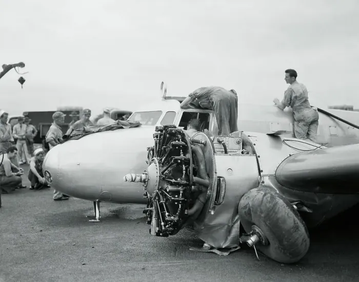 Framed Print : Workers Examining Amelia Earhart's Airplane for Engine Problems Framed Print : Workers Examining Amelia Earhart's Airplane for Engine Problems