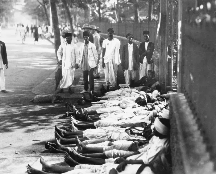 Framed Print : Workers in India Lie Prone in Front of Shop Framed Print : Workers in India Lie Prone in Front of Shop