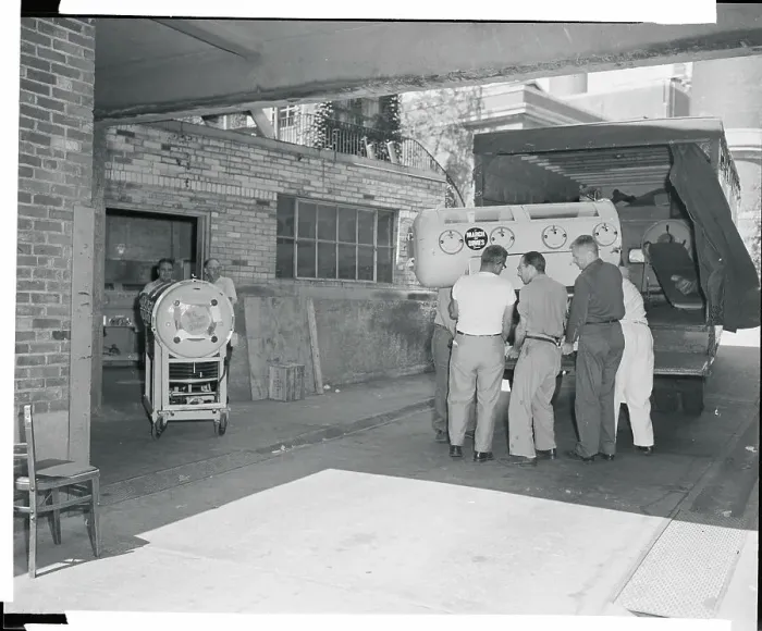 Framed Print : Workers Removing Hospital Machinery