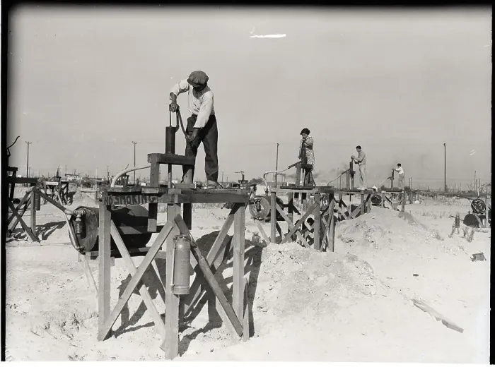 Framed Print : Workers Standing On Miniature Oil Wells Framed Print : Workers Standing On Miniature Oil Wells