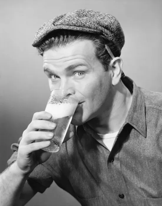 Framed Print : Workman in cap drinking beer in studio, (B&W), (Close-up), (Portrait) Framed Print : Workman in cap drinking beer in studio, (B&W), (Close-up), (Portrait)