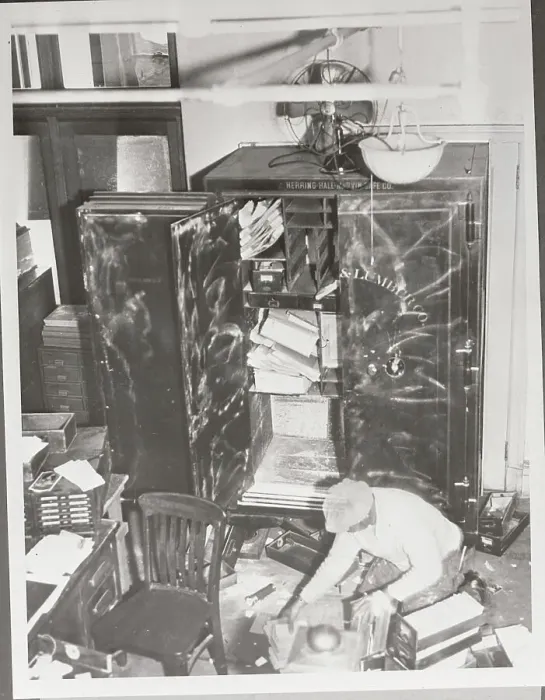 Framed Print : Workman Cleaning Debris after Robbery Framed Print : Workman Cleaning Debris after Robbery