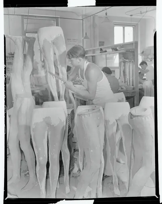 Framed Print : Workman Filing Mannequin Legs Framed Print : Workman Filing Mannequin Legs