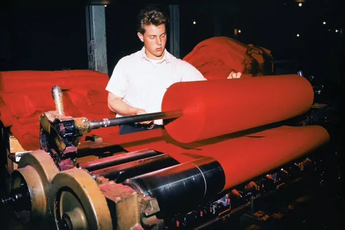 Framed Print : Workman Placing Bolts of Cloth on Roller Machine Framed Print : Workman Placing Bolts of Cloth on Roller Machine