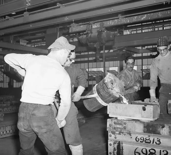 Framed Print : Workmen Pouring Molten Metal Into Mold Framed Print : Workmen Pouring Molten Metal Into Mold