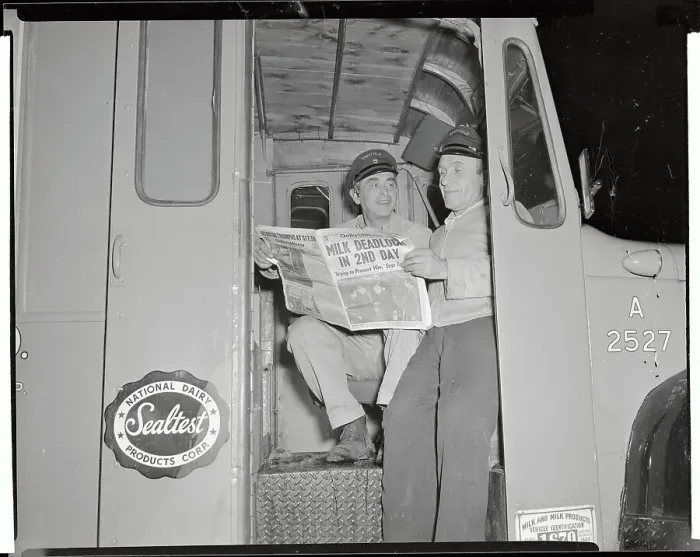 Framed Print : Workmen Reading Newspaper in Milk Truck Framed Print : Workmen Reading Newspaper in Milk Truck