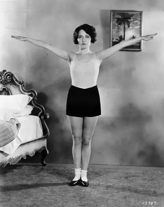 Framed Print : Workout. circa 1930: Deep breathing is stimulated by extending the arms outwards