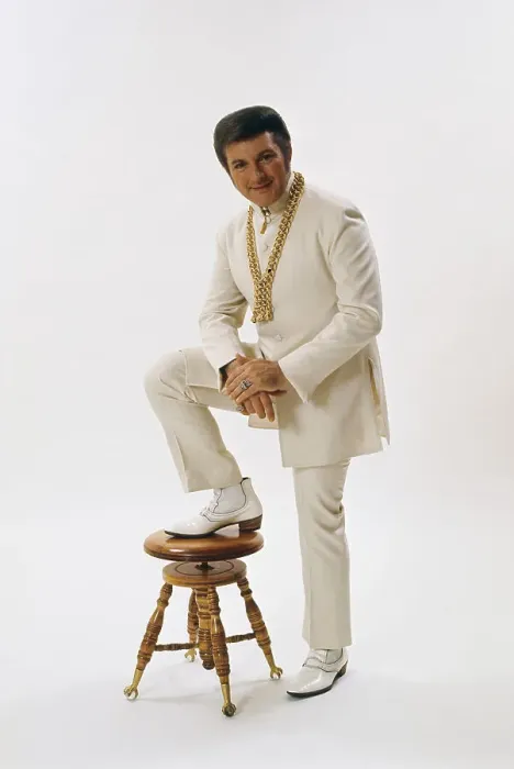 Framed Print : World Famous Liberace Posing in White on White Set Framed Print : World Famous Liberace Posing in White on White Set