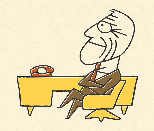 Worried Businessman Sitting at a Desk