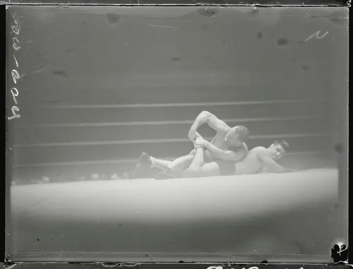 Framed Print : Wrestler Performing Toe Hold Move Framed Print : Wrestler Performing Toe Hold Move
