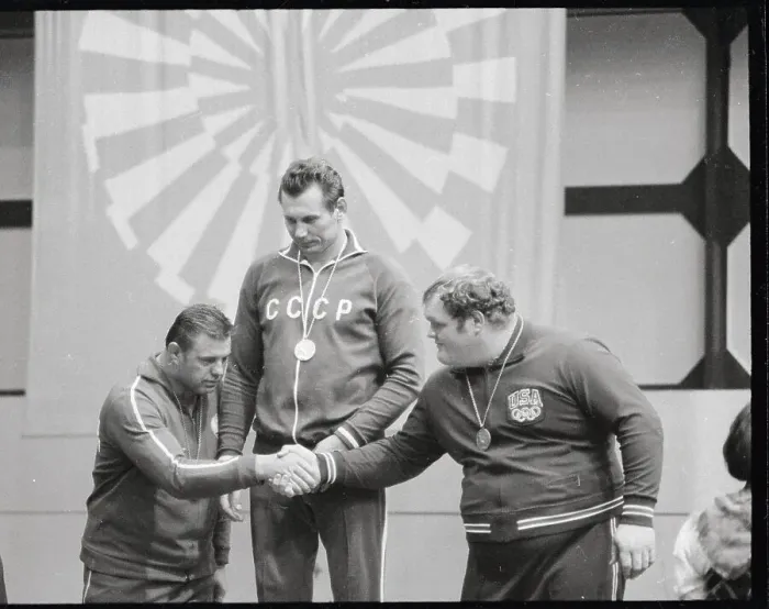 Framed Print : Two Wrestlers Shaking Hands on Olympic Podium Framed Print : Two Wrestlers Shaking Hands on Olympic Podium