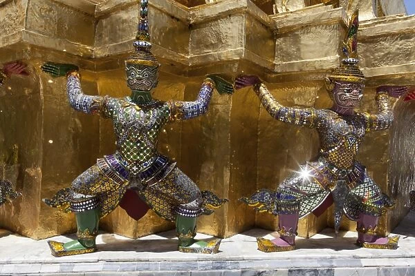 Yaksha statues at the golden chedi, Wat Phra Kaeo or Wat Phra Kaew, Grand Palace, Royal Palace, Bangkok, Thailand