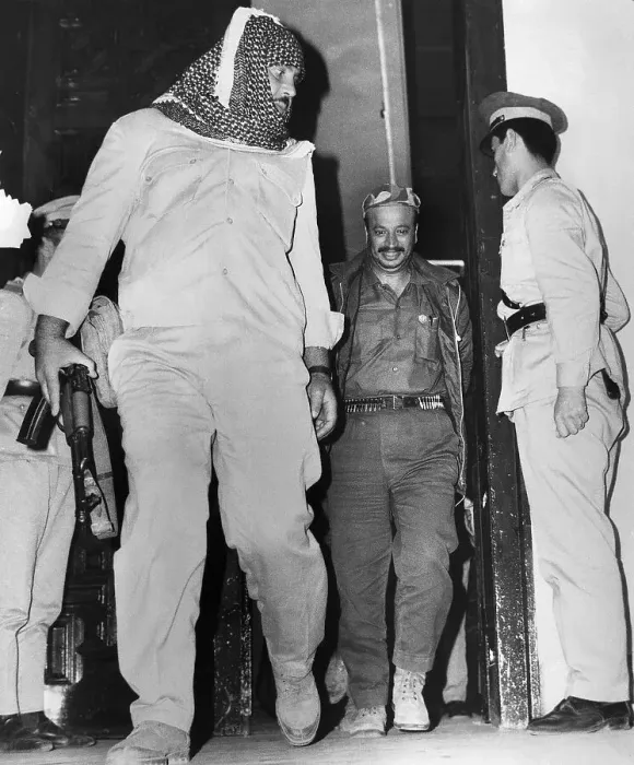 Framed Print : Yasser Arafat Leaves Building with Bodyguard Framed Print : Yasser Arafat Leaves Building with Bodyguard