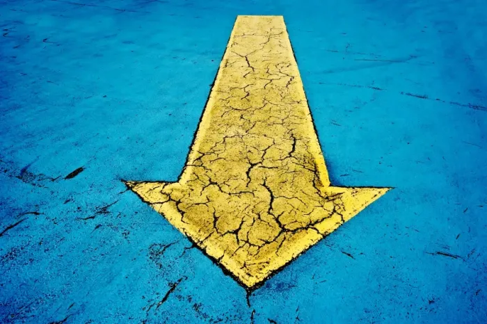 Framed Print : Yellow arrow on blue concrete with cracks Framed Print : Yellow arrow on blue concrete with cracks