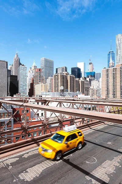 Yellow cab passing on Brooklyn bridge, New York, USA