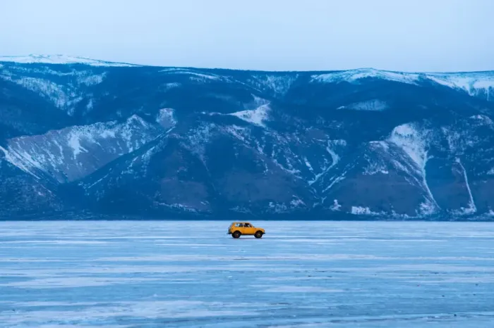 Framed Print : A yellow car on the frozen Baikal lake Framed Print : A yellow car on the frozen Baikal lake