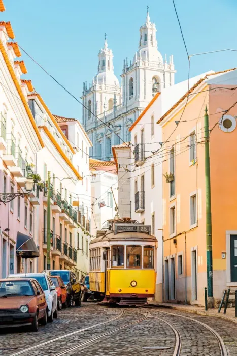 Framed Print : Yellow tram on the narrow street of Alfama district in Lisbon, Portugal Framed Print : Yellow tram on the narrow street of Alfama district in Lisbon, Portugal