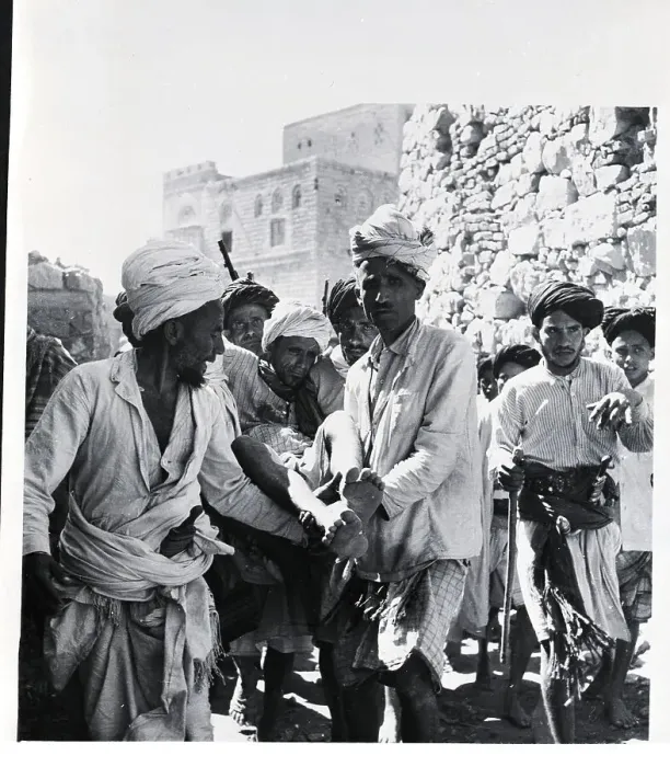 Framed Print : Yemeni Tribesmen Carry Wounded Man Framed Print : Yemeni Tribesmen Carry Wounded Man