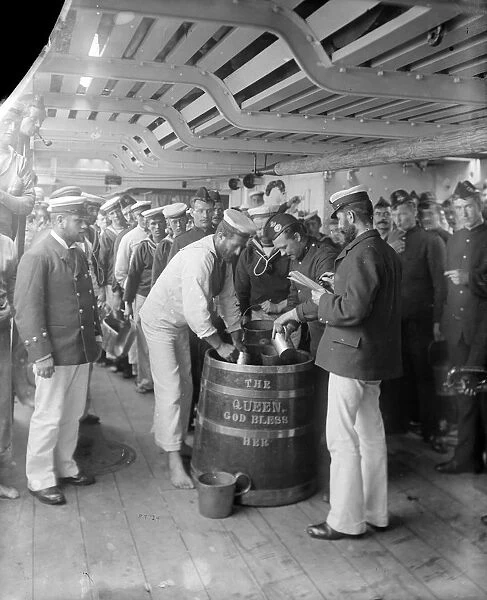 Yo Ho Ho. circa 1897: Sailors serving out grog on board the HMS Repulse