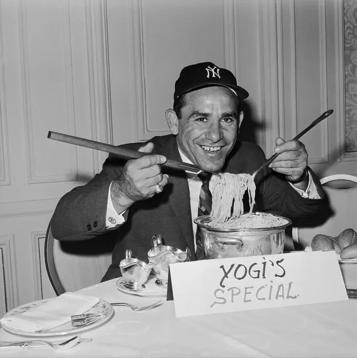Framed Print : Yogi Berra Digging into Pot of Spaghetti