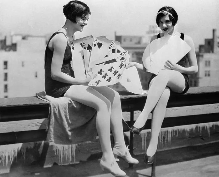 Framed Print : Yong smiling women playing big cards Framed Print : Yong smiling women playing big cards