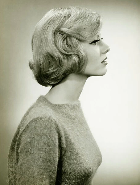 Young blonde woman in studio, (B&W), (Close-up)